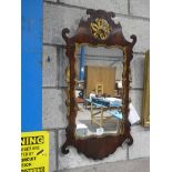 An 18th century mahogany Chippendale style wall mirror, with pierced cartouche and gilt fruit and