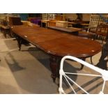 A Victorian style Mahogany D ended extending dining table with three extra leaves, approx 11ft