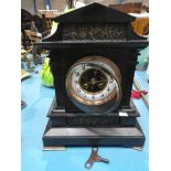 A black slate architectural mantle clock