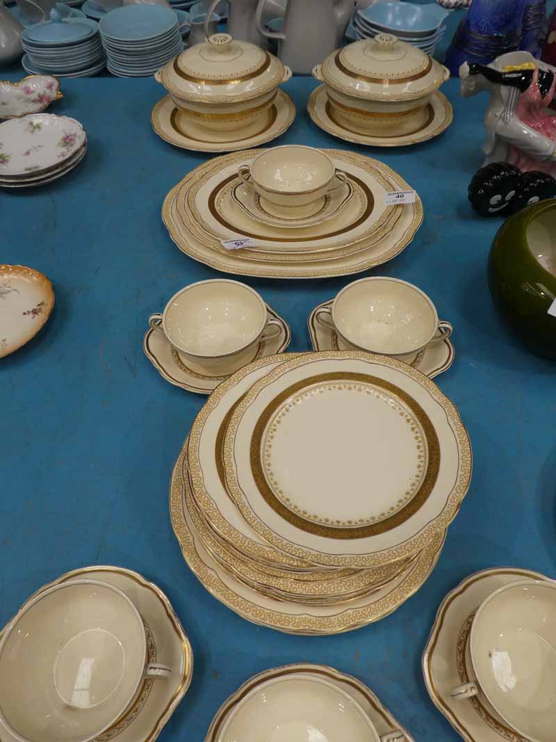 An Alfred Meakin cream and gilt 35 piece Dinner Service including tureens and soup set