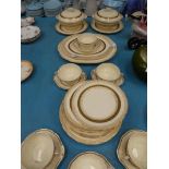 An Alfred Meakin cream and gilt 35 piece Dinner Service including tureens and soup set