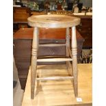 An elm top kitchen stool.