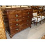 A large George III mahogany chest of 2 over 3 drawers, central hidden drawer to the frieze.