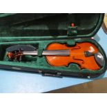 Cased students violin.