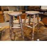 A pair of elm top 4 legged stools.