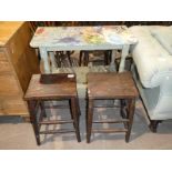 Two stools and a painted pine table.