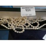 An Art Deco graduated single string pearl necklace, a baroque pearl choker, and a long string of