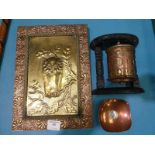 An arts and crafts copper and brass embossed wall plaque with an owl, a Tibetan copper prayer