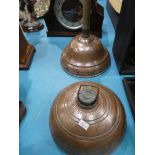 A copper posser and copper bed warmer.