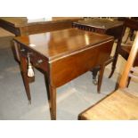 19th century mahogany Pembroke table on square legs.