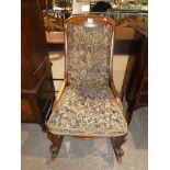 A Victorian mahogany Nursing Chair converted to a rocking chair