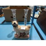 Pair of lead crystal candlesticks and a pottery staffordshire style pug dog.