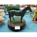 A Beswick stallion in rare green glaze and a circular plinth.