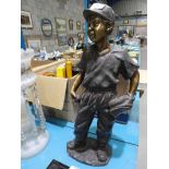 A bronze patinated cast metal figural model as a Baseball player. 50cm high