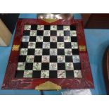A Chinese fold up chess compendium and chess men.