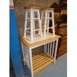 A modern tiled top ash and white painted breakfast bar with a pair of stools.