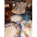 Pottery jug and bowl and four Victorian plates.