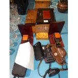 Eight treen boxes, a pair of book ends and four vintage cameras