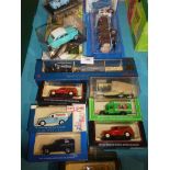 Thirteen unopened model vehicles, mainly small commercials.