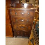 Oak chest of three drawers over two door cabinet
