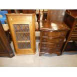 A small Serpentine front chest of four drawers and an oak corner wall cabinet