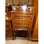 An Edwardian inlaid mahogany music cabinet