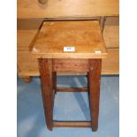 A mahogany square top bar stool