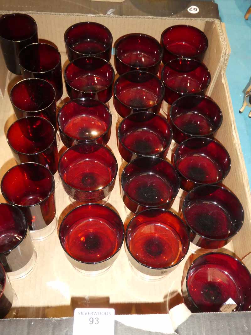 A set of sixteen ruby glass sundae dishes and a set of seven similar wine glasses