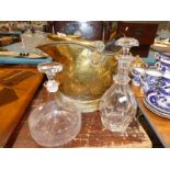 Brass coal helmet and two glass decanters