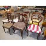 Three 19th century spindle back kitchen chairs, two odd Victorian balloon back chairs, and a pair of