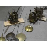Three, eight day long-case clock movements 18-19th century and a group of five long-case pendulums