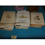 A collection of Beatrix Potter books, various titles and publishing dates though some early