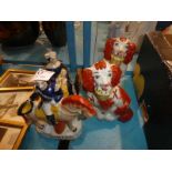 A pair of Staffordshire style dogs and two repro flat-back figures