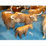 A Beswick Highland cattle family