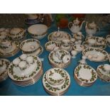 An extensive Christmas dinner service by Royal Grafton, white and gilt decorated with holly sprigs