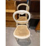 A pair of cane seated balloon back chairs