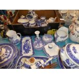 A collection of mixed blue and white ware, mainly in the Willow Pattern design