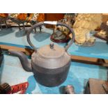 A five pint cast iron kettle and lid
