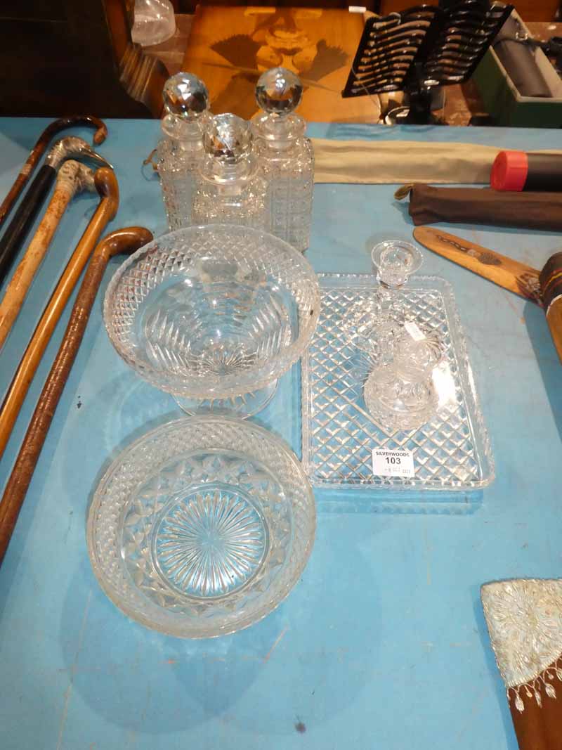 Eight items of cut and moulded glass including decanters and fruit bowls etc