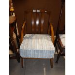 A beech wood low nursing style armchair.