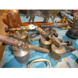 Five brass pressure blow lamps