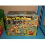 A 'Snow White' child's sewing machine in original box