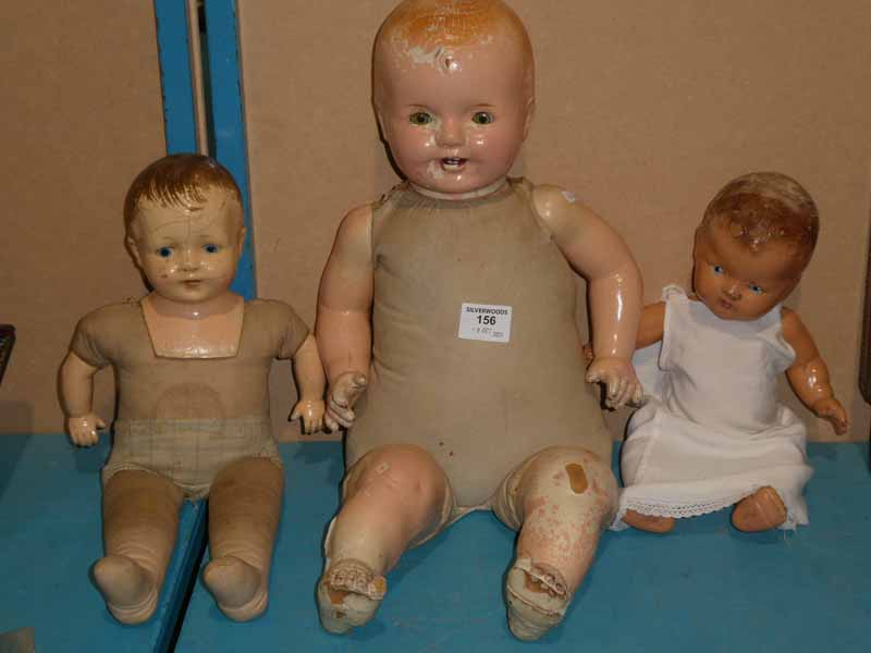 A large early to mid 20th century composite head doll with composite limbs, a smaller similar
