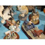 Four cast resin models of birds of prey and three resin models of farming scenes