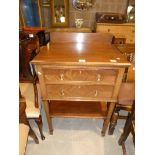 A mahogany two drawer serving cabinet with cutlery drawer and under shelf
