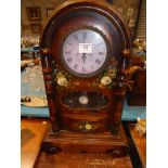 A painted reproduction arch top mantle clock