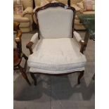 A cream upholstered Gentlemans armchair