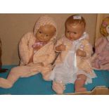 Two early to mid 20th century composite dolls in knitted attire - 55cm