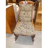 A Victorian mahogany Nursing Chair converted to a rocking chair