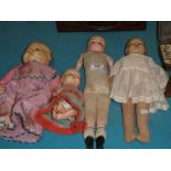 A group of four mid 20th century dolls, three with plastic heads, one of composite with material